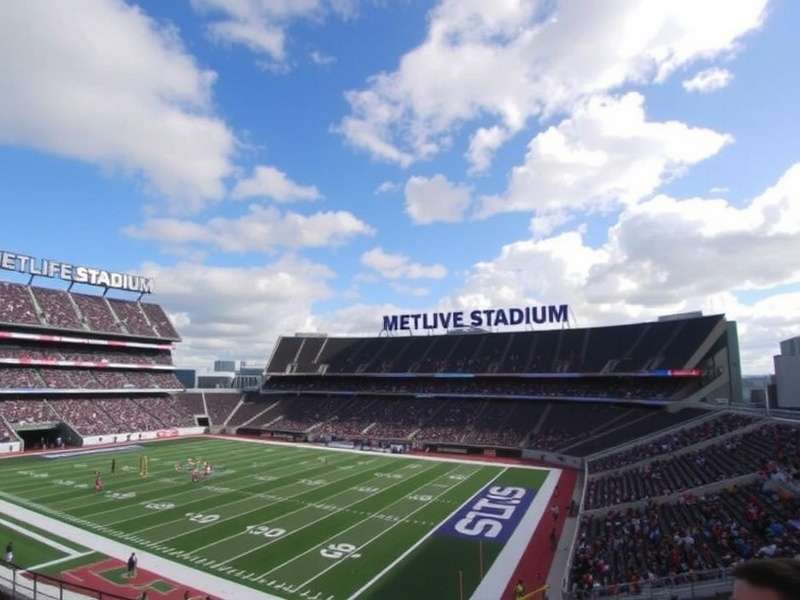 Aerial view of MetLife Stadium packed with fans on game day, New Jersey skyline in the background